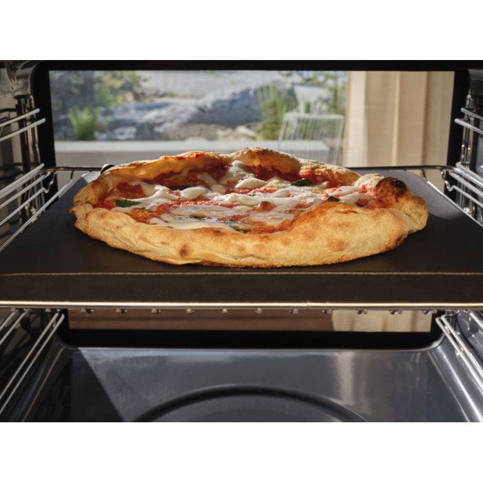 A neapolitan pizza baking inside the pizza expert oven